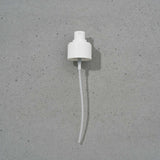 White plastic reusable spray top on a gray background. To be used with Mist Norwegian Sea Silk.