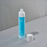 RUA Nordic Beauty - Mist Norwegian Sea Silk bottle with white cap on a gray surface