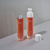 Two bottles of RUA Nordic Beauty Remove Multi Use Cleanser on a gray surface with a neutral background