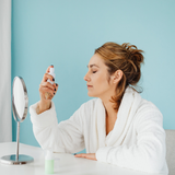 Woman in mirror during skincare training
